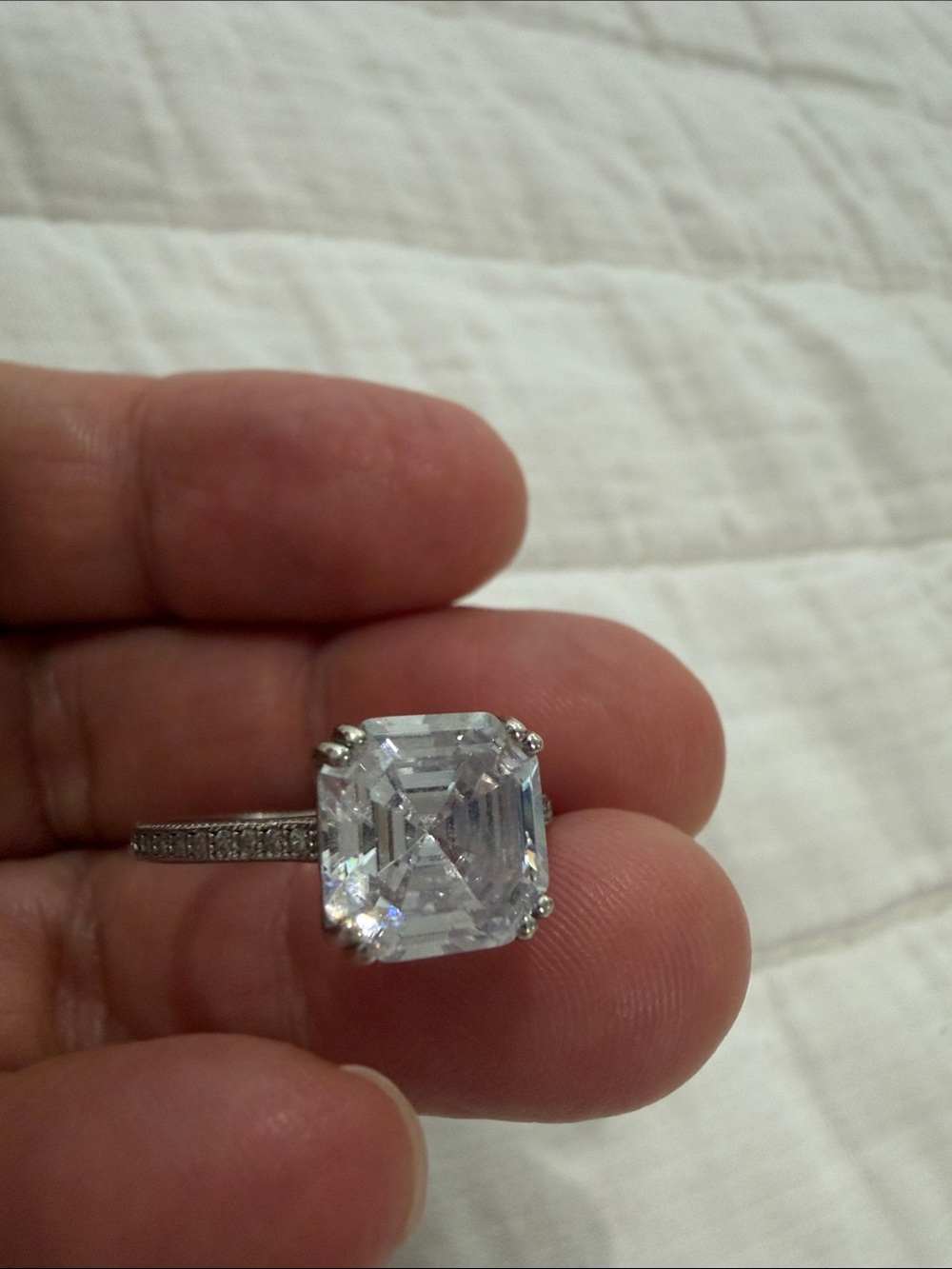 Elegant Silver Halo Engagement Ring with Clear Emerald-Cut Center Stone